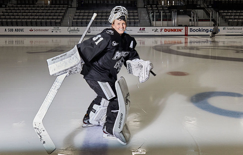 Clare Minnerath '20 smiles as she skates across the Schneider Arena ice.