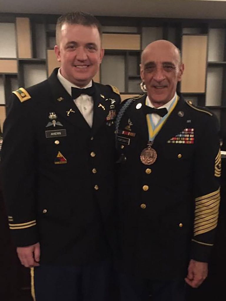 RING Major Jeffrey Ahern, left, is one of hundreds of Patriot Battalion graduates who credit Sgt. Major Fortunato for their personal development as a military officer. Ahern is currently the logistics officer for the 56th Troop Command.