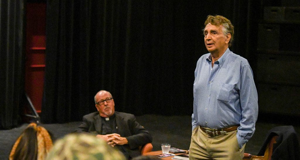 John Bowab ’55 & ’89Hon. speaks to students who participated in the musical “Something Rotten” during a visit to campus in October 2019. At rear is Rev. Kenneth R. Gumbert O.P., professor of film studies in theatre.