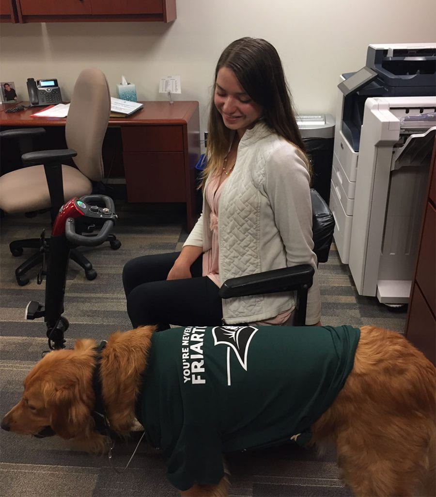 Jacquie Kelley '20 and her service dog, Moose, helped the College with the marketing of Mental Health Awareness Month. Moose is sporting a "You're Never Alone in Friartown" T-shirt.
