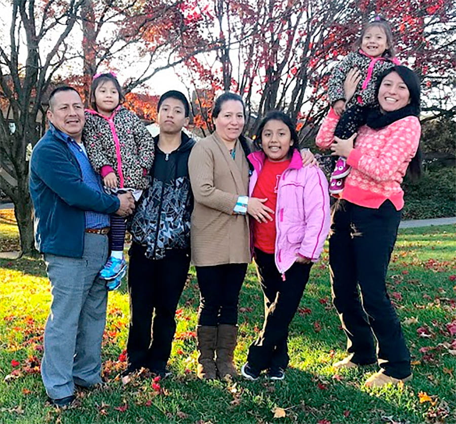 Katherine, holding her baby sister, Sofia Uchupailla, with her family. From left are her father, Angel Polivio Uchupailla; sister, Diana Uchupailla; younger brother, Angel Daniel Uchupailla; mother, Adelina Uchupailla; and younger sister, Jocelyn Uchupailla.