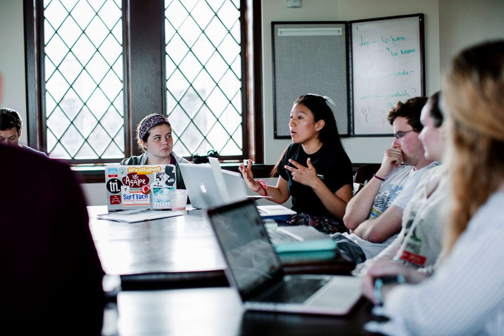 Katherine Uchupailla ’20 gestures while making a point during a theology class, Global Service in Solidarity, in the Ruane Center for the Humanities.