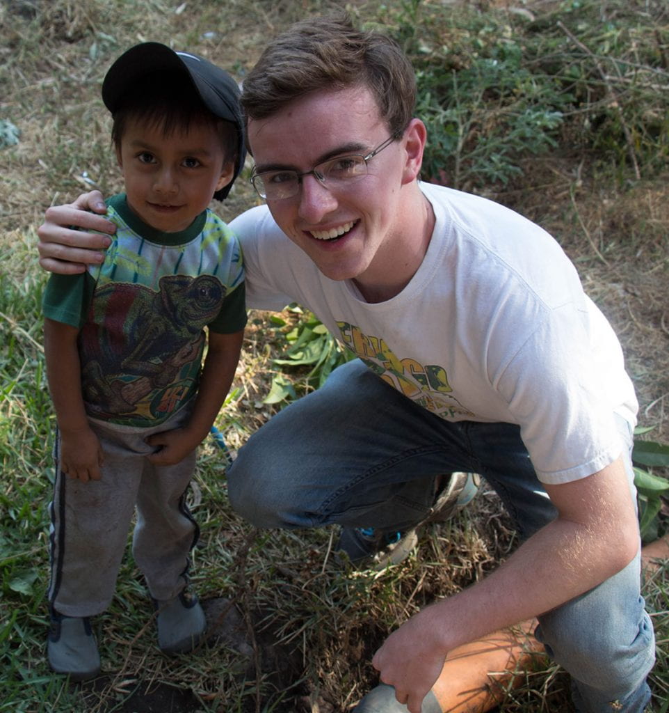 During a theology course trip to Guatemala, Jack Murphy '20 poses with a young boy.