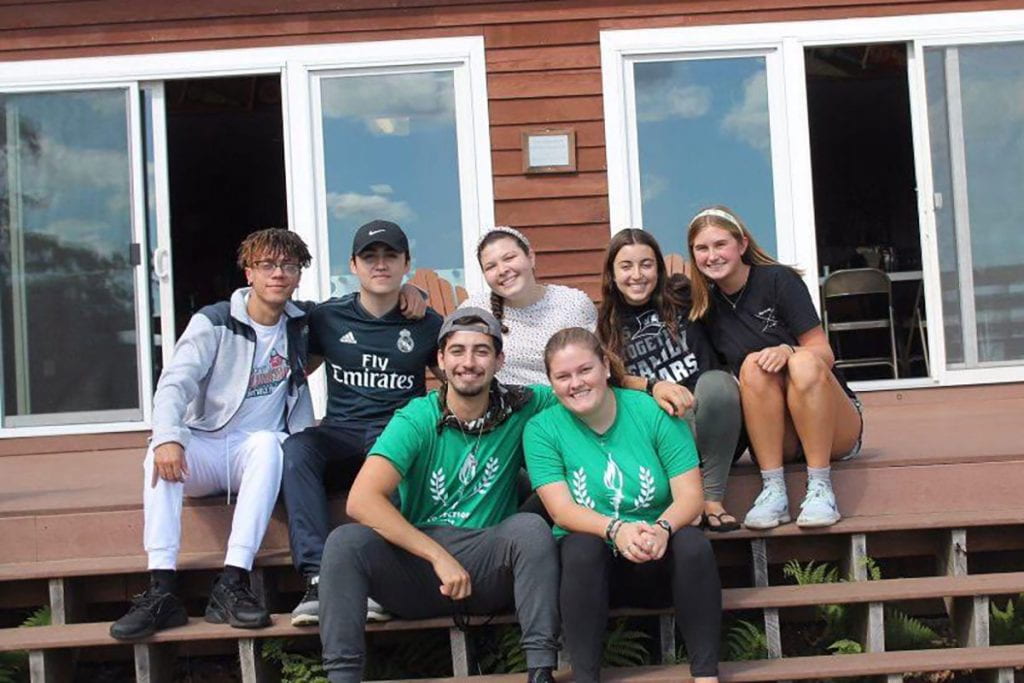 Nathan Perez ’20 leads a Campus Ministry Connections program retreat last year for first-year students. Alongside him is another leader, Caroline Shaper ’22. At rear from left are Yamel Camilo ’23, Gabriel Cardenal ’23, Analisa Pisano ’23, Sara Filler ’23, and Katie Glinka ’23.