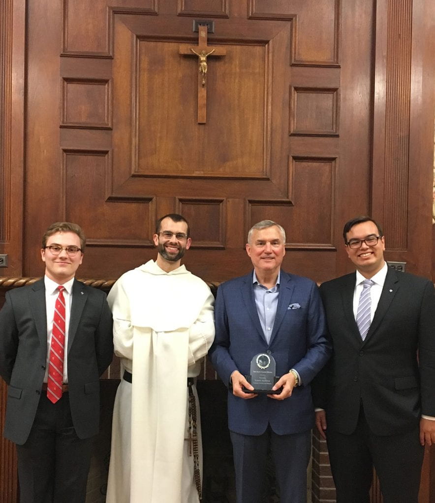 Sean Tobin ’20, left, who was grand knight of PC’s Knights of Columbus council the past two years, conferred the St. Joseph Award to Leonard N. Alsfeld ’74, third from left, at a council meeting in 2018. Others are Rev. Bonaventure Chapman, O.P. and Nathaniel Thomas ’18 (now Brother Nicodemus Thomas, O.P.).