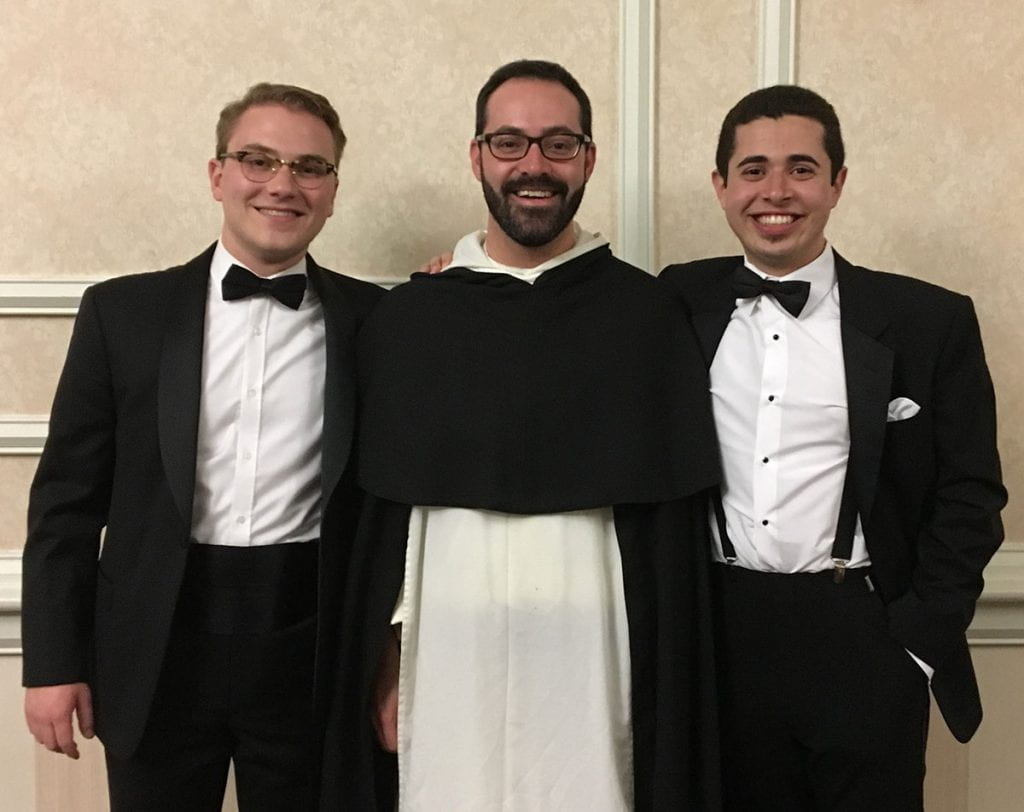 From left, Sean Tobin ’20, Rev. Michael Weibley, O.P., associate College chaplain, and Daniel Arteaga ’19 (now Brother Raphael Mary Arteaga) at the Class of 2019 commencement formal night
