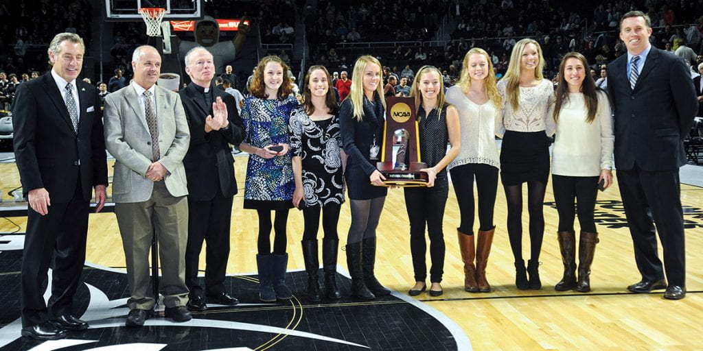 Father Shanley recognizes the women and coaches who won the 2013 NCAA Women's Cross Country Championship.