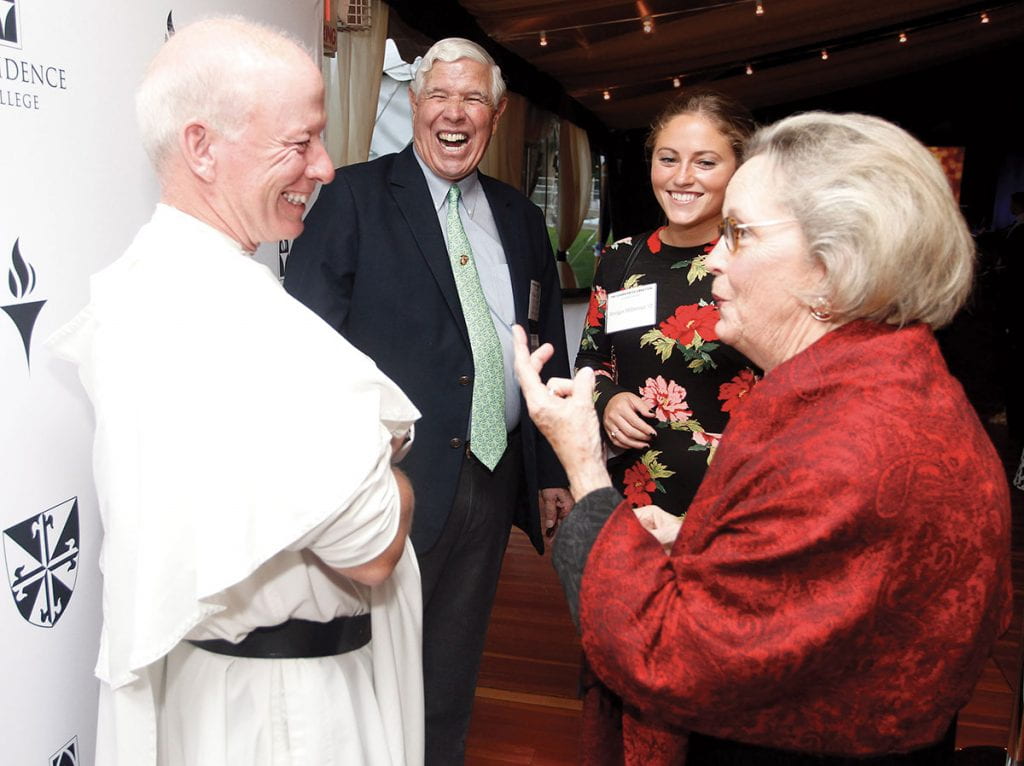 Father Shanley laughs with members of the Christie family during a celebration to mark the close of the successful Our Moment fundraising campaign in 2017. William Christie '61 & '11Hon. and his wife, Maryann Christie, are with their granddaughter, Bridget Hillsman '17 & '19G. The campaign raised $187 million, far exceeding the $140 million goal.
