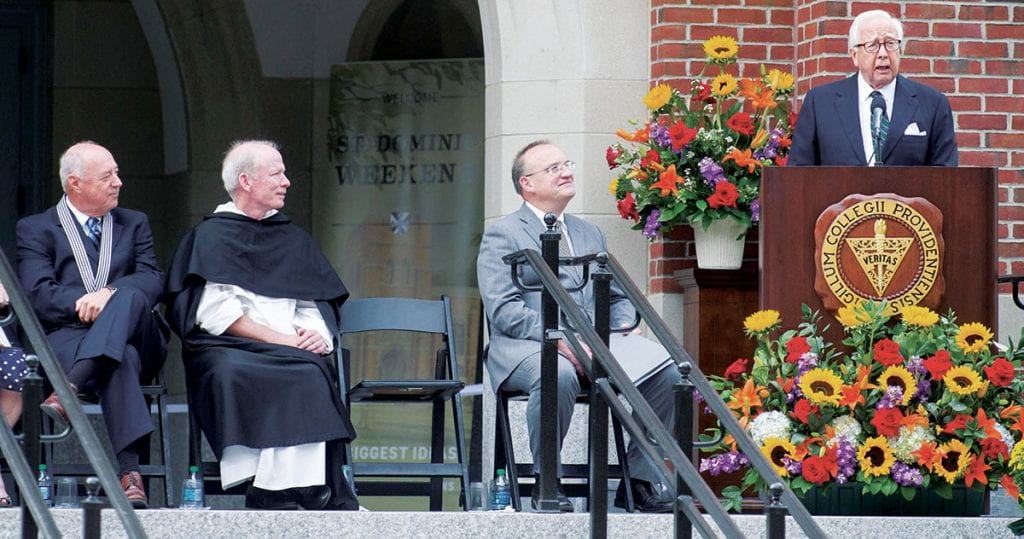 One of Father Shanley's happiest moments as president was the dedication of the Ruane Center for the Humanities in October 2013 with historian and author David McCullough as the keynote speaker. Listening with Father Shanley are Michael A. Ruane '71 & '17Hon., left, former trustee chair who gave the lead gift for the building, and Dr. Hugh F. Lena, provost and senior vice president for academic affairs.