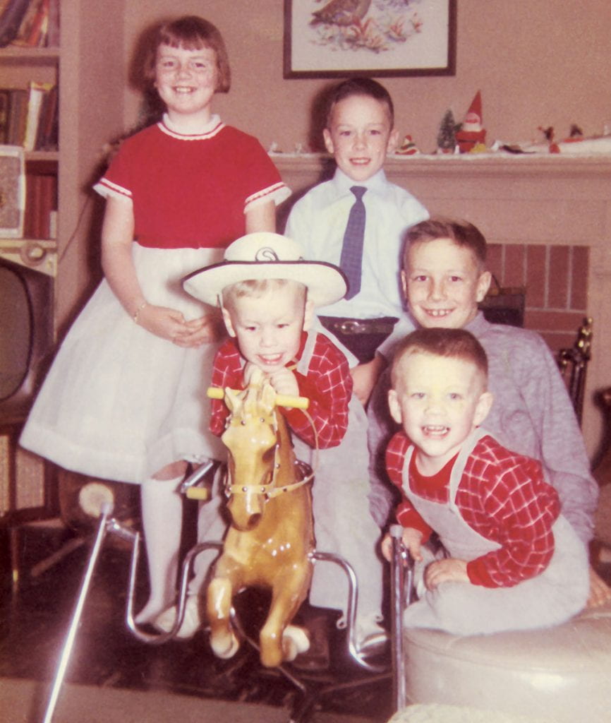 The five little Shanleys, clockwise from top left, Kathryn, Michael, Andrew, Paul, and Brian, on the rocking horse.