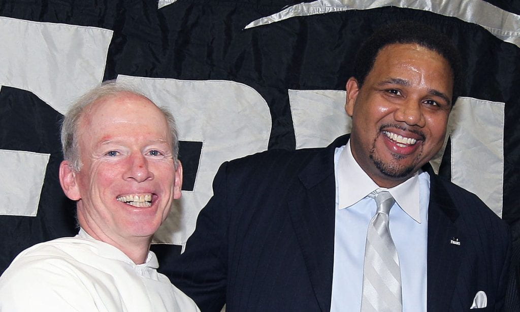 Men's basketball coach Ed Cooley with College President Rev. Brian J. Shanley, O.P. '80