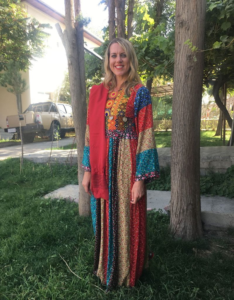 Laurie Hart ’03 wears a traditional Afghan dress she was given by her students in Afghanistan.