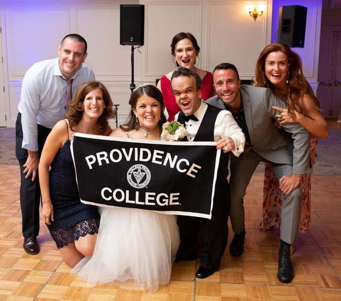With Becky Curran Kekula ’06 and Ryan Kekula at their wedding reception are, from left, Brian Carney ’09, Laura Pagluica ’06, Joanna Shannon ’06, Jared Bogda ’06, and Sheila Lennon ’93.