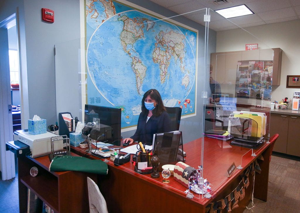 New plexiglass has been installed around the desk of administrative coordinator Anna Iadeluca in the Center for Global Education.