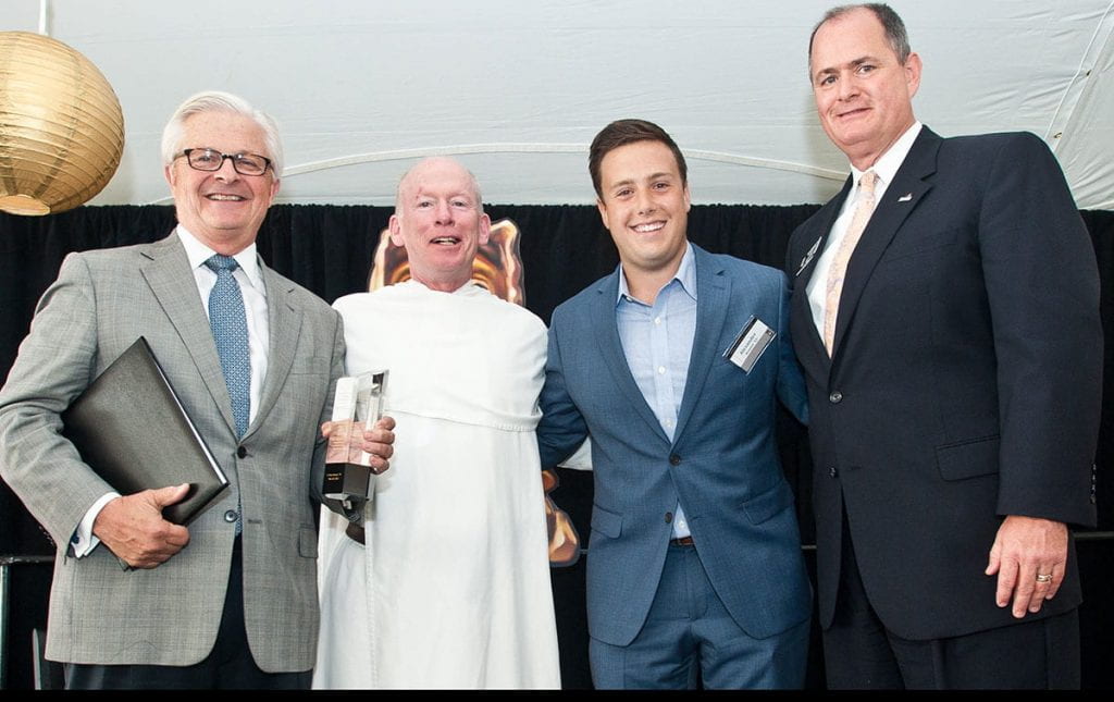 During the National Alumni Association awards brunch in May 2015, J. Peter Benzie '70 was honored with the NAA's Personal Achievement Award. With Mr. Benzie, from left, are College President Rev, Brian J. Shanley, O.P. '80; Alexander Acunzo '15; and Michael Lynch '83, NAA president.