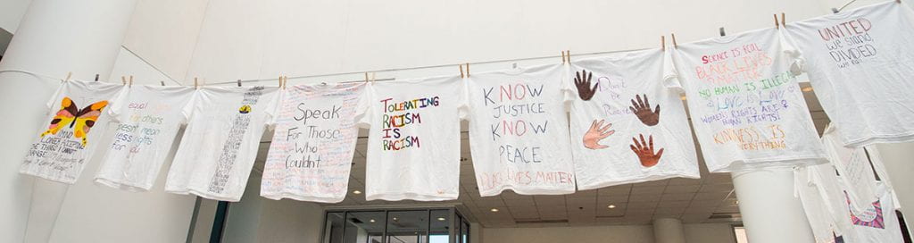 Student-created T-shirts promoting racial justice were displayed on clotheslines outside Slavin Center during the fall semester.