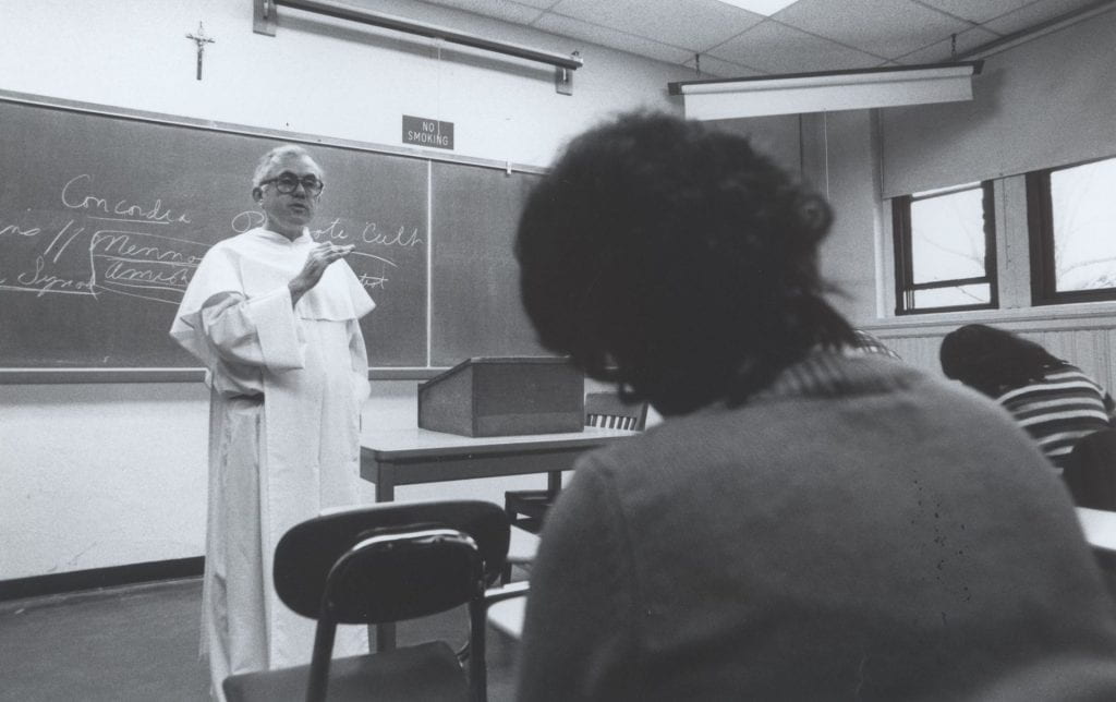 Rev. J. Stuart McPhail, O.P. ’61 addresses students in a theology class in 1978.