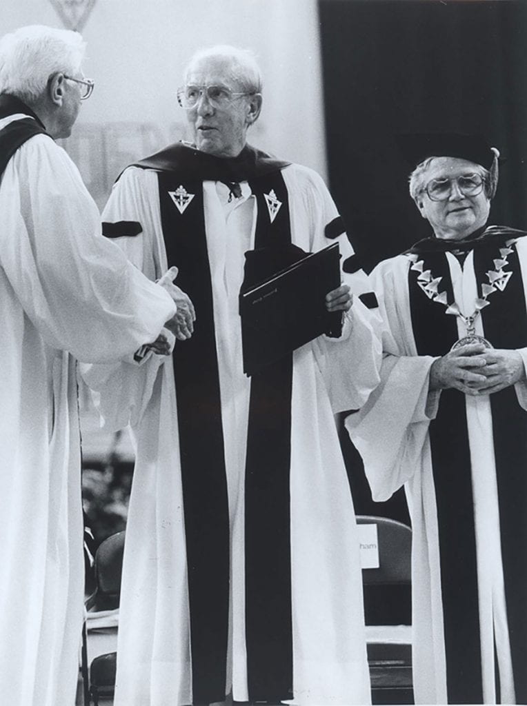 William R. Davis, Esq. ’52 & ’91Hon., second from left, accepts his honorary doctorate at commencement in 1991 from Rev. Thomas J. Ertle, O.P. ’53, ’82G, & ’84Hon., prior provincial of the Dominican Province of St. Joseph. At right is College President Rev. John F. Cunningham, O.P. ’50.