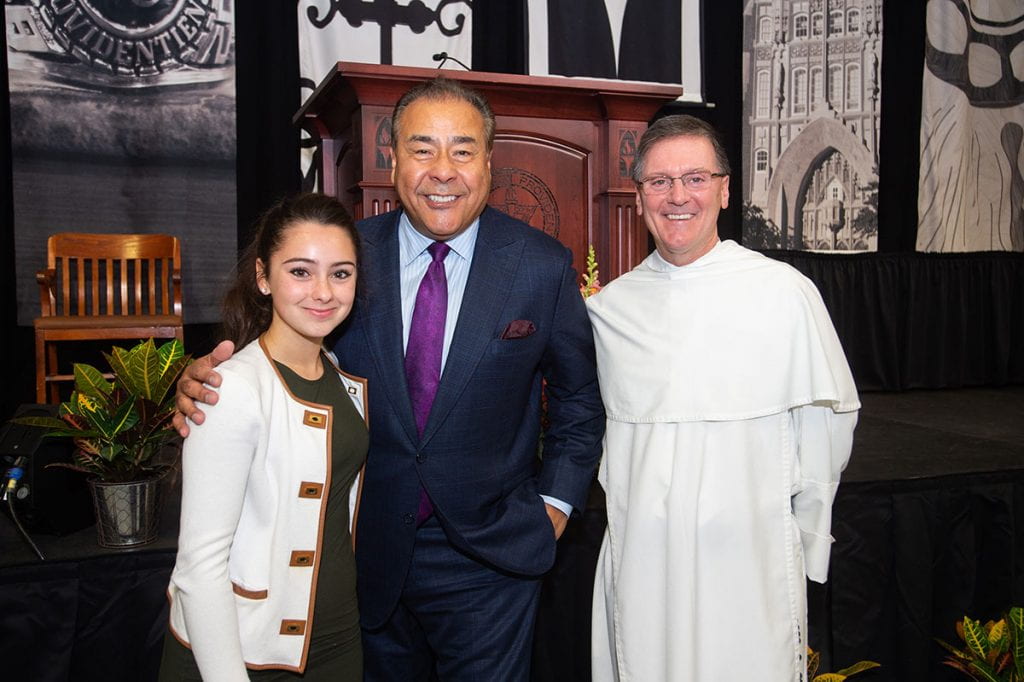 From left, Eliana DaCunha ’22, then president of the first-year class; keynote speaker John Quiñones, ABC News correspondent; and Rev. Kenneth R. Sicard, O.P. ’78 & ’82G, then College executive vice president/ treasurer, at the 2018 New Student Family Weekend program. DaCunha and Father Sicard, now PC president, gave welcoming remarks.