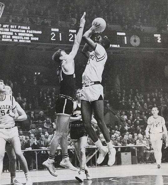 PC center John Thompson Jr. ’64 goes up for a shot against Marquette in the 1963 NIT semifinals at Madison Square Garden. The Friars won, 70-64, and went on to defeat Canisius in the championship game. In right background is Ray Flynn ’63.
