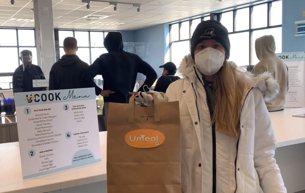 In this still from the UMelt pitch for the BIG EAST Startup Challenge, Faith Linscott '21 holds a UMelt bag in a dining hall.