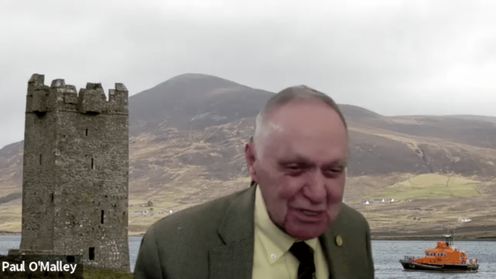 Paul O'Malley with Irish castle Zoom background