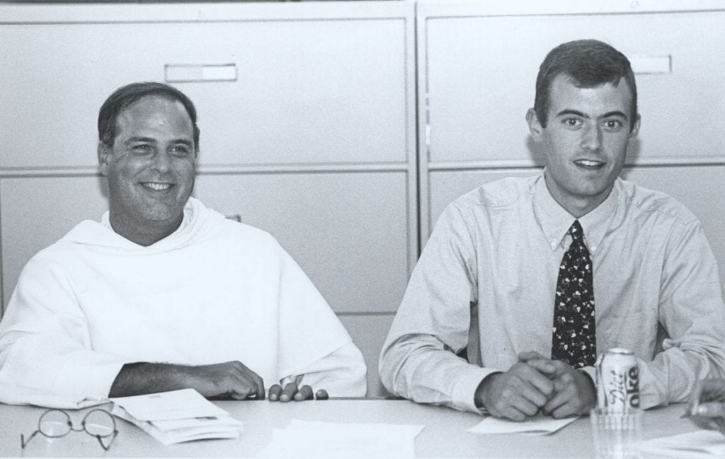 Then College Chaplain Rev. Joseph Barranger, O.P. sits alongside Michael Cuddy ‘’98, now Rev. James Cuddy, O.P. ’98, PC vice president for mission and ministry, at a meeting of the Campus Ministry Council during Father Cuddy’s undergraduate days. Father Barranger recently returned to campus to become chaplain of the PC National Alumni Association.