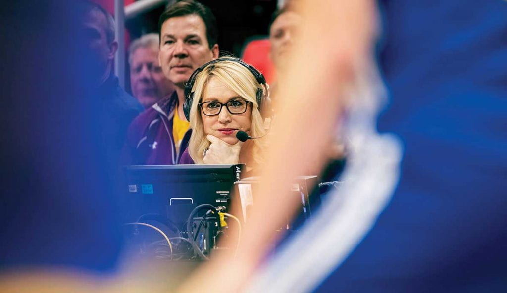 ESPN NBA analyst Doris Burke ’87, ’92G, ’05Hon. watches the action as the Detroit Pistons play the Golden State Warriors at Little Caesars Arena in Detroit.