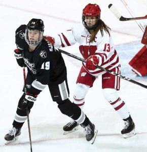 PC’s Sara Hjalmarsson ‘22 eyes the puck in the NCAA game against Wisconsin.