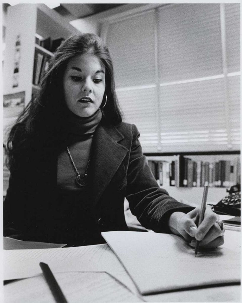 Professor emerita Jane Lunin Perel '15Hon. writes on a tablet in the year she was hired to teach English, 1971.
