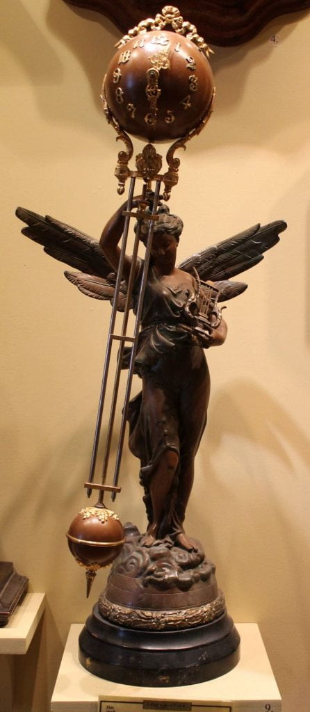 8-day, spring-driven brass movement figural ball swinger timepiece c.1875 Made by the Ansonia Clock Company, Ansonia, Conn.