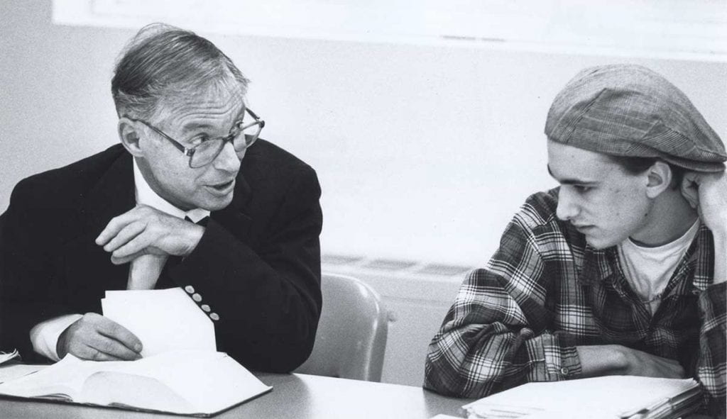 Dr. John Hennedy, professor of English, with a student in an undated photo
