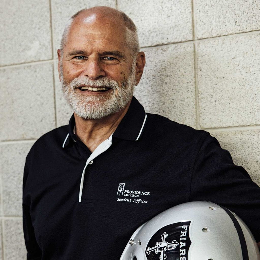 Richy Kless '74, '78G, '82SCE, holding his club football helmet, retired in June from his position as associate director of community standards.