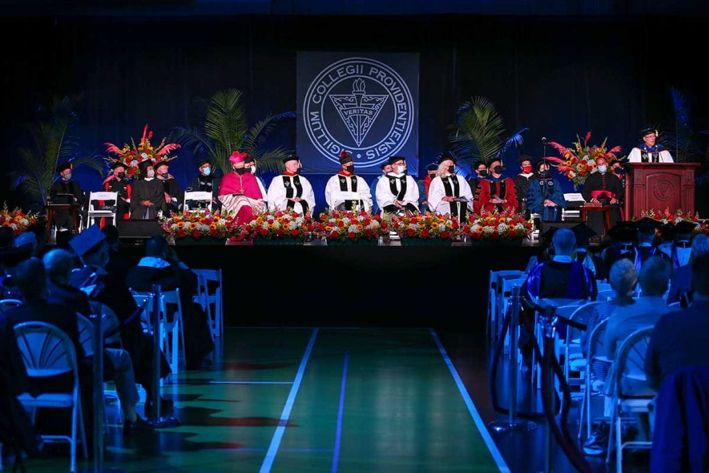 College President Rev. Kenneth R. Sicard, O.P. '78, '82G presents his inaugural address in Peterson Recreation Center. Long view showing stage.