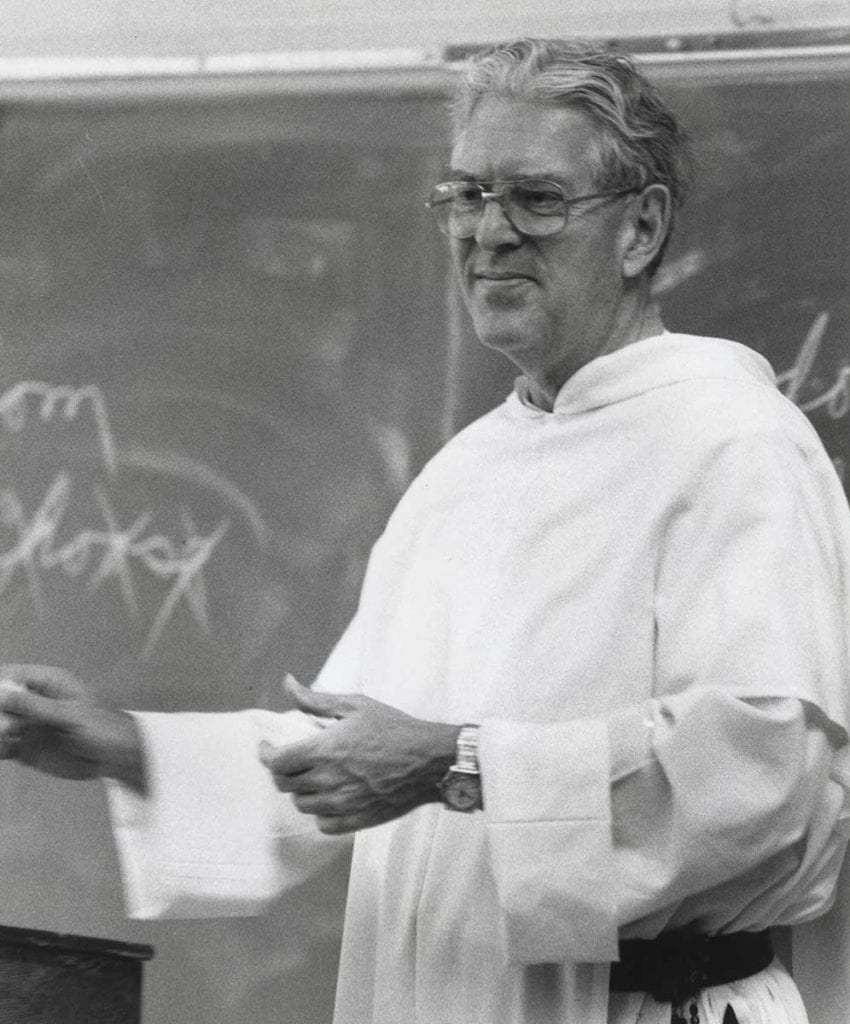 Rev. Thomas R. Peterson, O.P. '52, 9th president of Providence College, teaching in 1984.