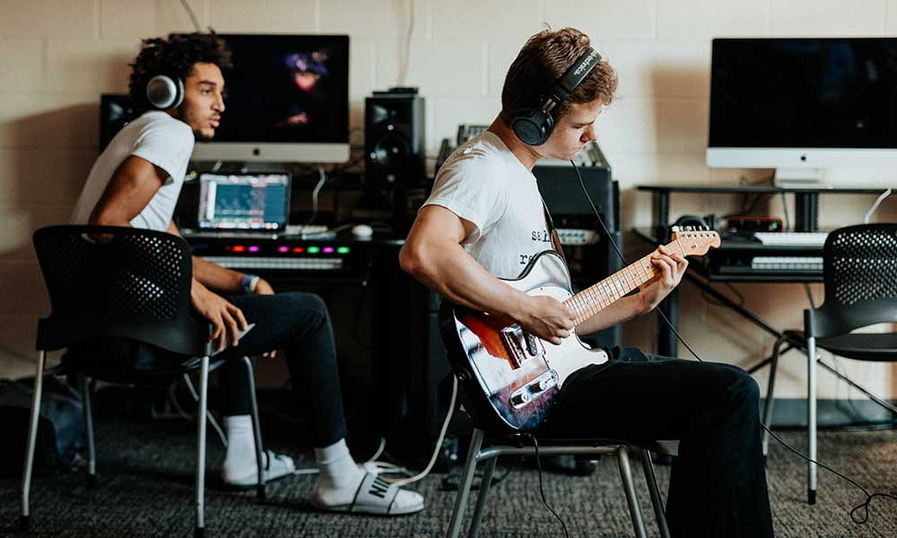Students in Dr. William Longo's Songwriting course in the Music Technology and Production Lab in the Smith Center for the Arts.