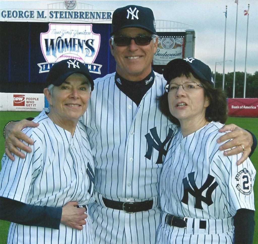 Fay Rozovsky '73, '08Hon. left, and her sister, Ann Frank Goldstein '75, with Bucky Dent at the Yankees fantasy camp for women in 2015.
