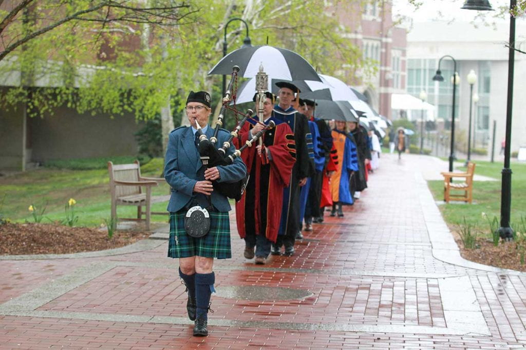 The procession of faculty, staff, and students walks from the Ruane Center for the Humanities to St. Dominic Chapel for the Phi Beta Kappa installation ceremony.