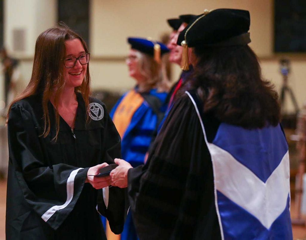 Madison Palmieri '22 is congratulated as she is inducted into Phi Beta Kappa.