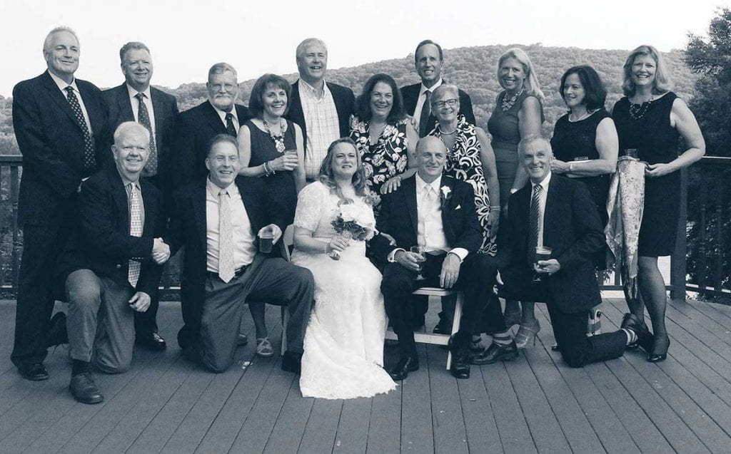 Donna Formichella '78 and John Hannen '78 on their wedding day in 2015, surrounded by Friar friends.