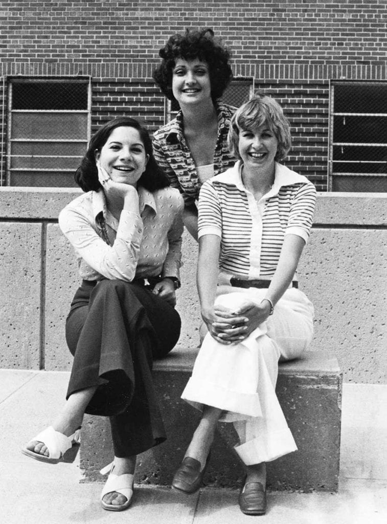 Patricia Slonina Vieira '75, seated at right, was the first woman to edit The Alembic, the Providence College literary magazine. She is pictured with the other women who also were the first editors of publications — Ann Frank Goldstein '75 of The Cowl, the student newspaper, seated at left, and Ana Margarita Cabrera '75 of Veritas, the yearbook, standing.