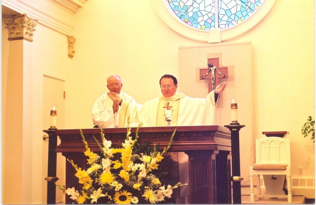 Rev. Francis Hicks at altar