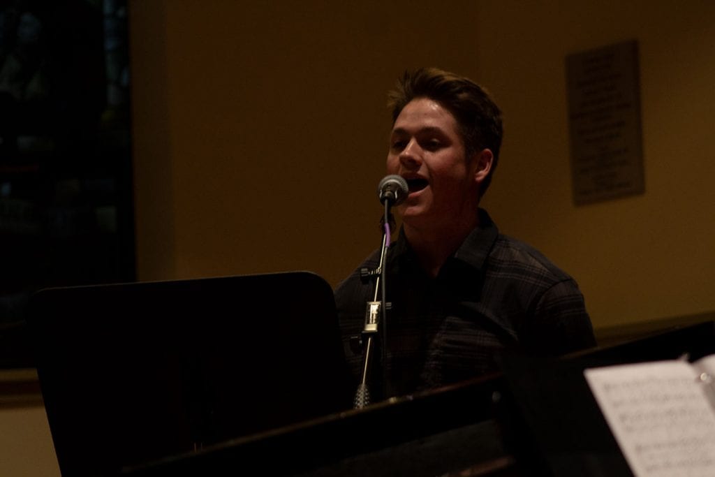 Singing during the candlelight vigil in St. Dominic Chapel (Photo by Cristopher Alvarez '22, PC Photography Club)