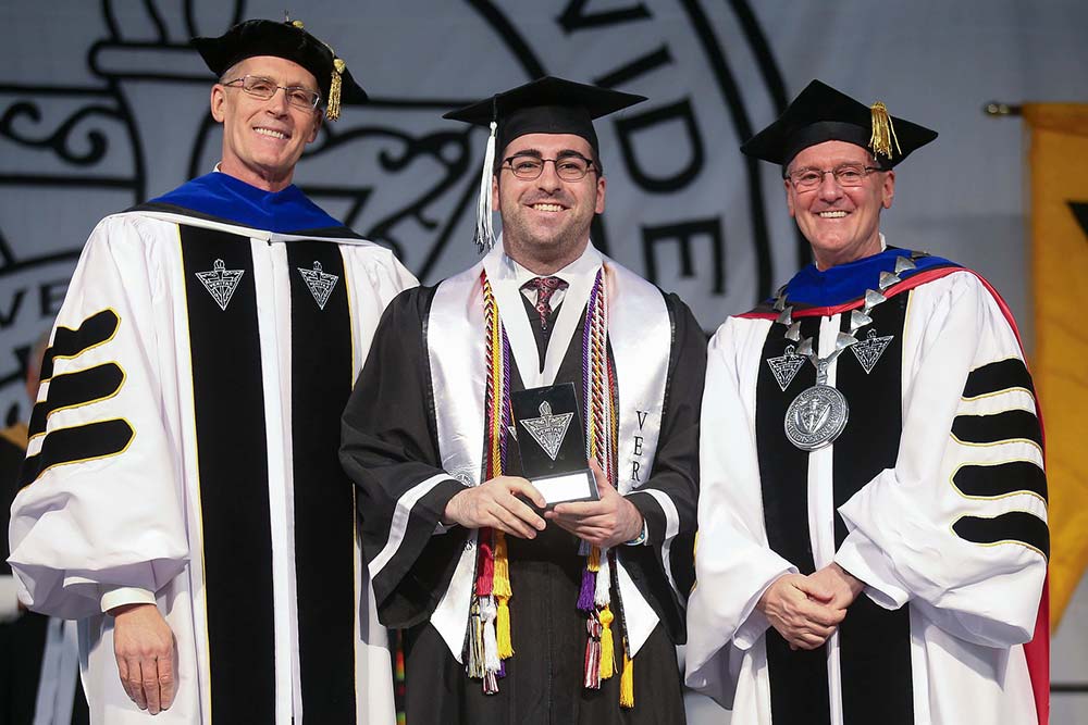 Matthew Lussier '22 with College President Kenneth R. Sicard, O.P. '78 & '82G and Provost Sean Reid