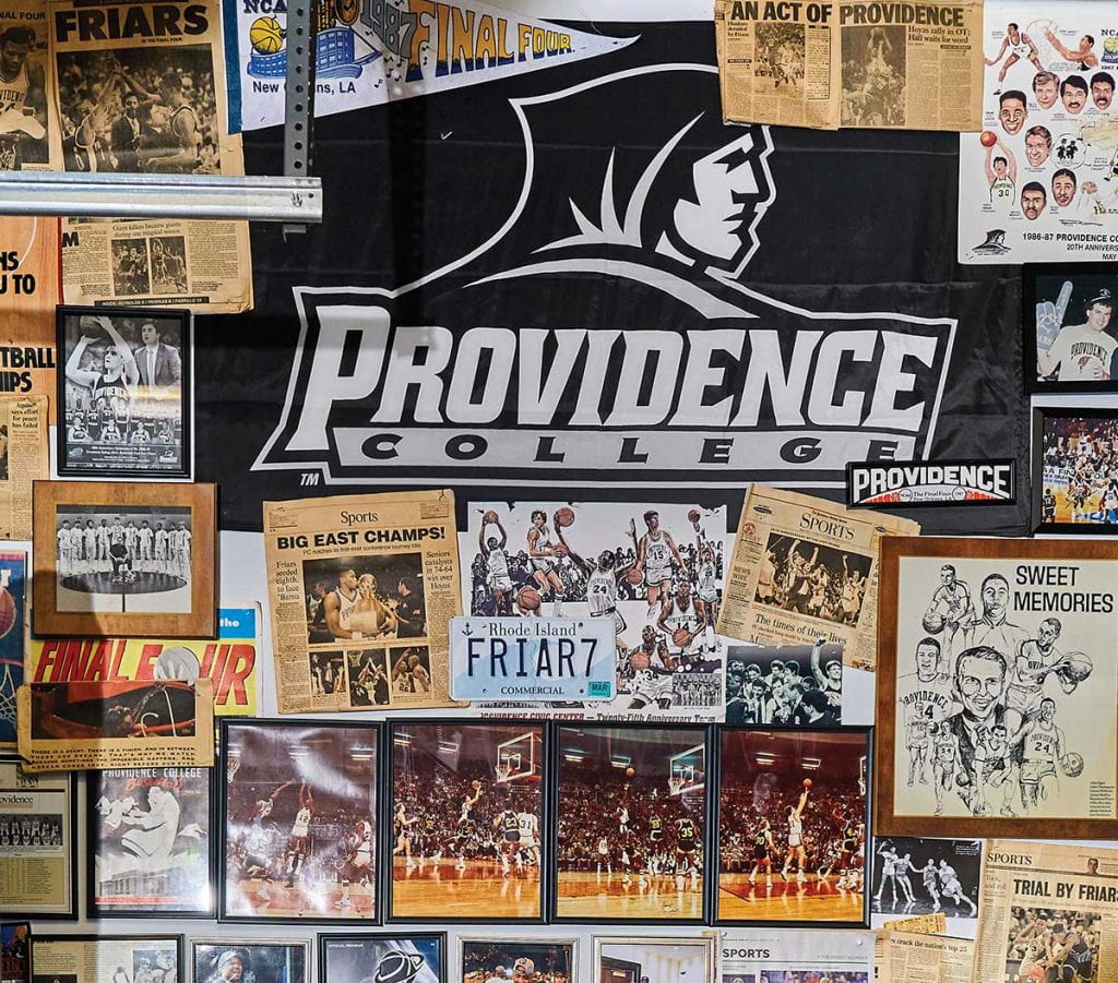 The walls in the game room of Kerry Rafanelli '80 are covered in Friar memorabilia from his student days to the present.