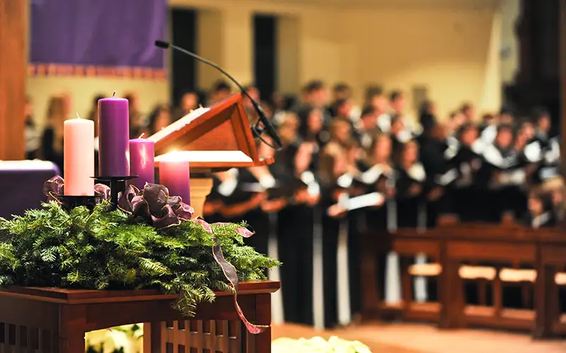 choir singing in the chapel during advent