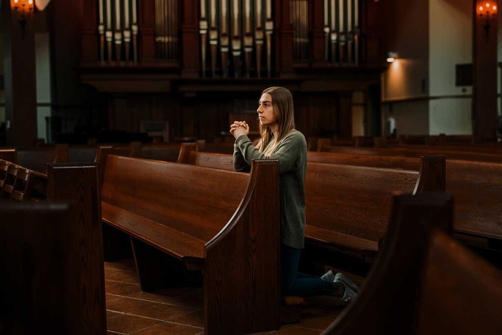 Lydia Watson '22 at prayer in St. Dominic Chapel