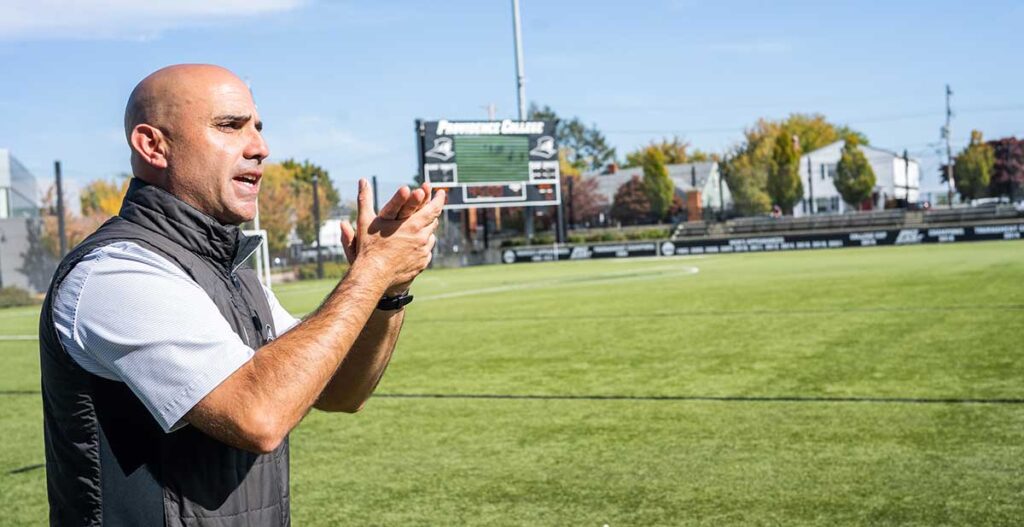 Steve Napolillo '98 on the sidelines of a women's soccer game in October 2022.