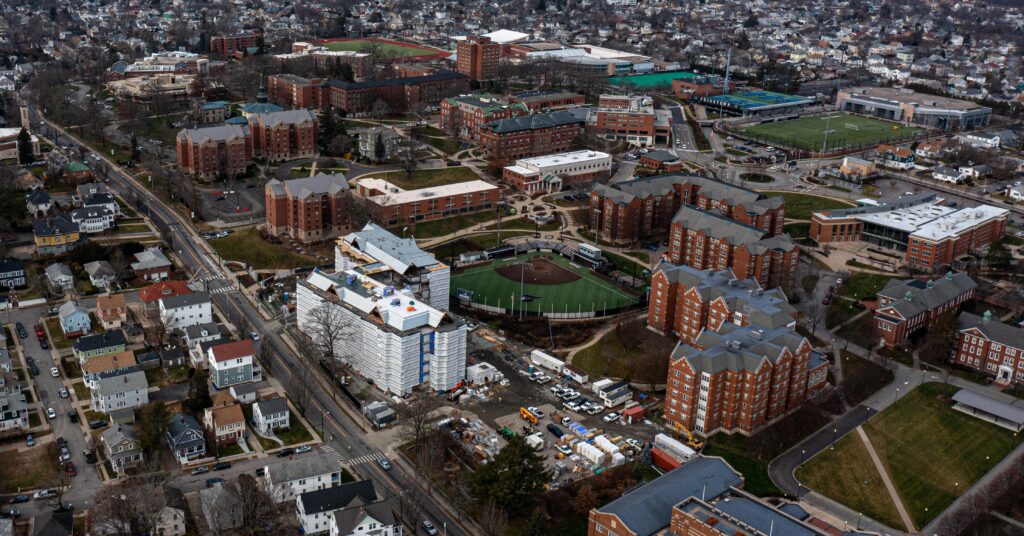 A drone shot of Providence College's campus with Shanley Hall under construction in the foreground.