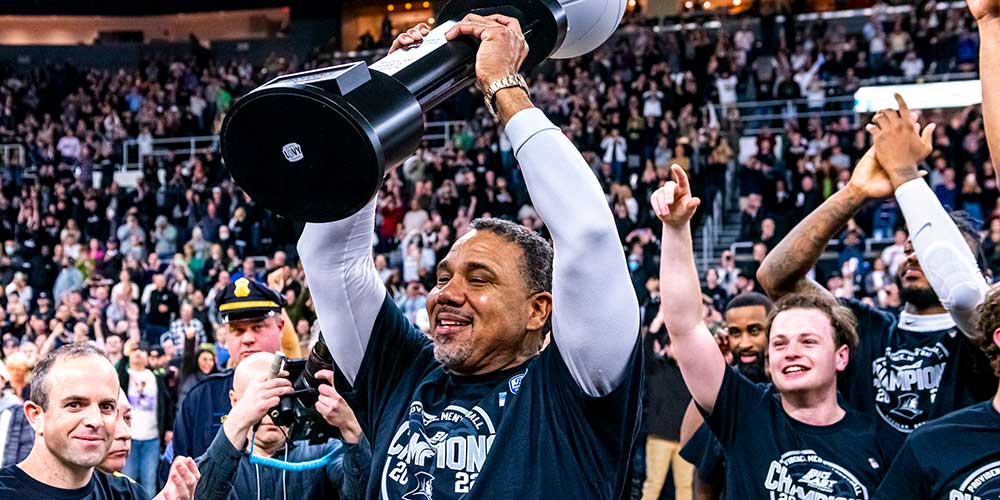 Ed Cooley hoists Big East regular season trophy